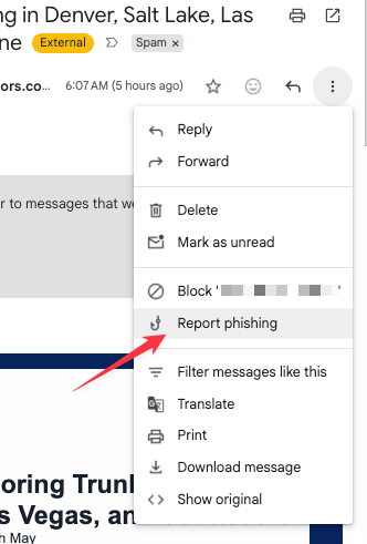 A callout showing the location of the Report phishing button in Gmail