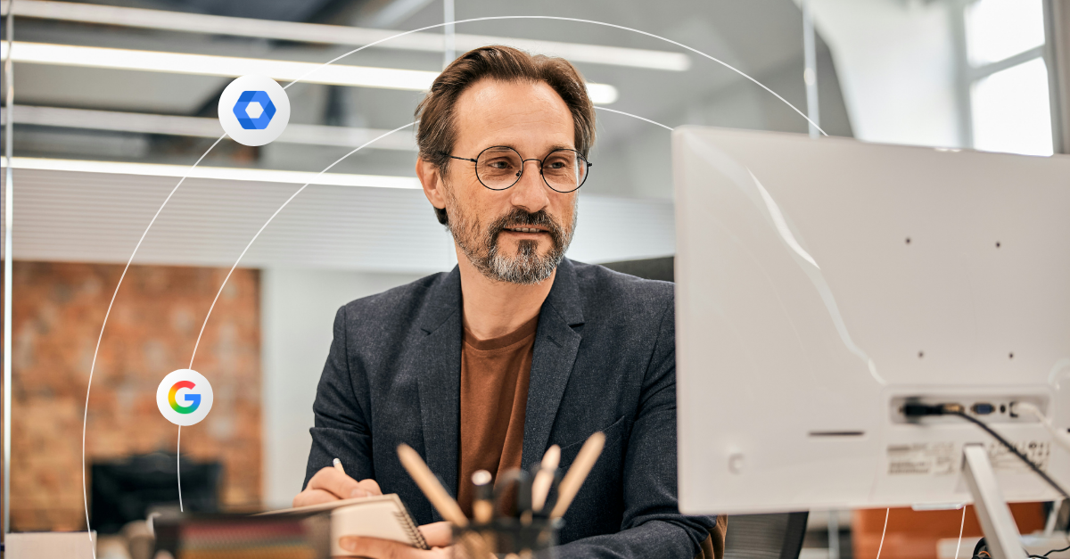 Professional man looks at a computer screen in a modern office setting