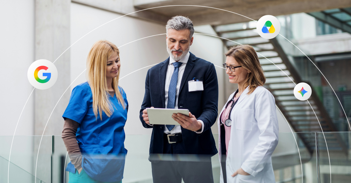 Three healthcare professionals talk in a modern office setting